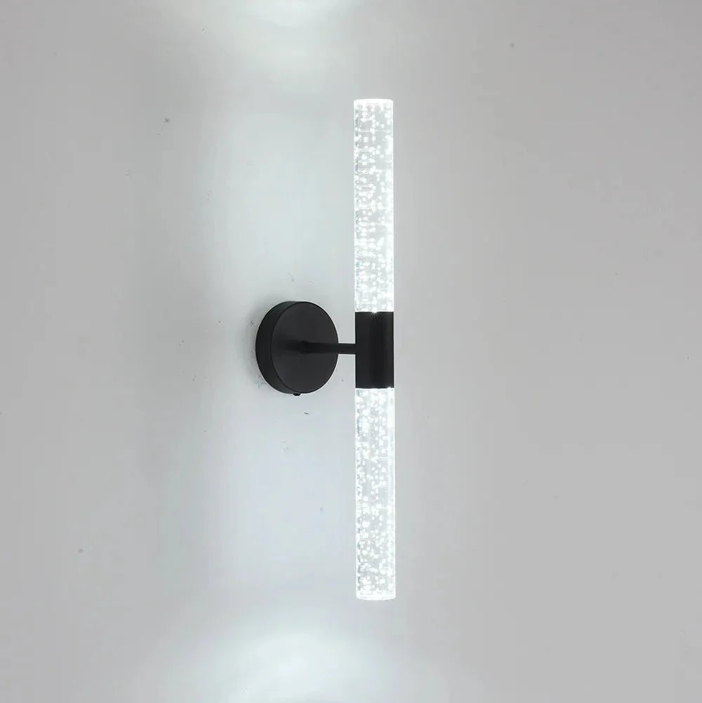 Bubble crystal rod wall sconce in black with a cool white 6000K glow