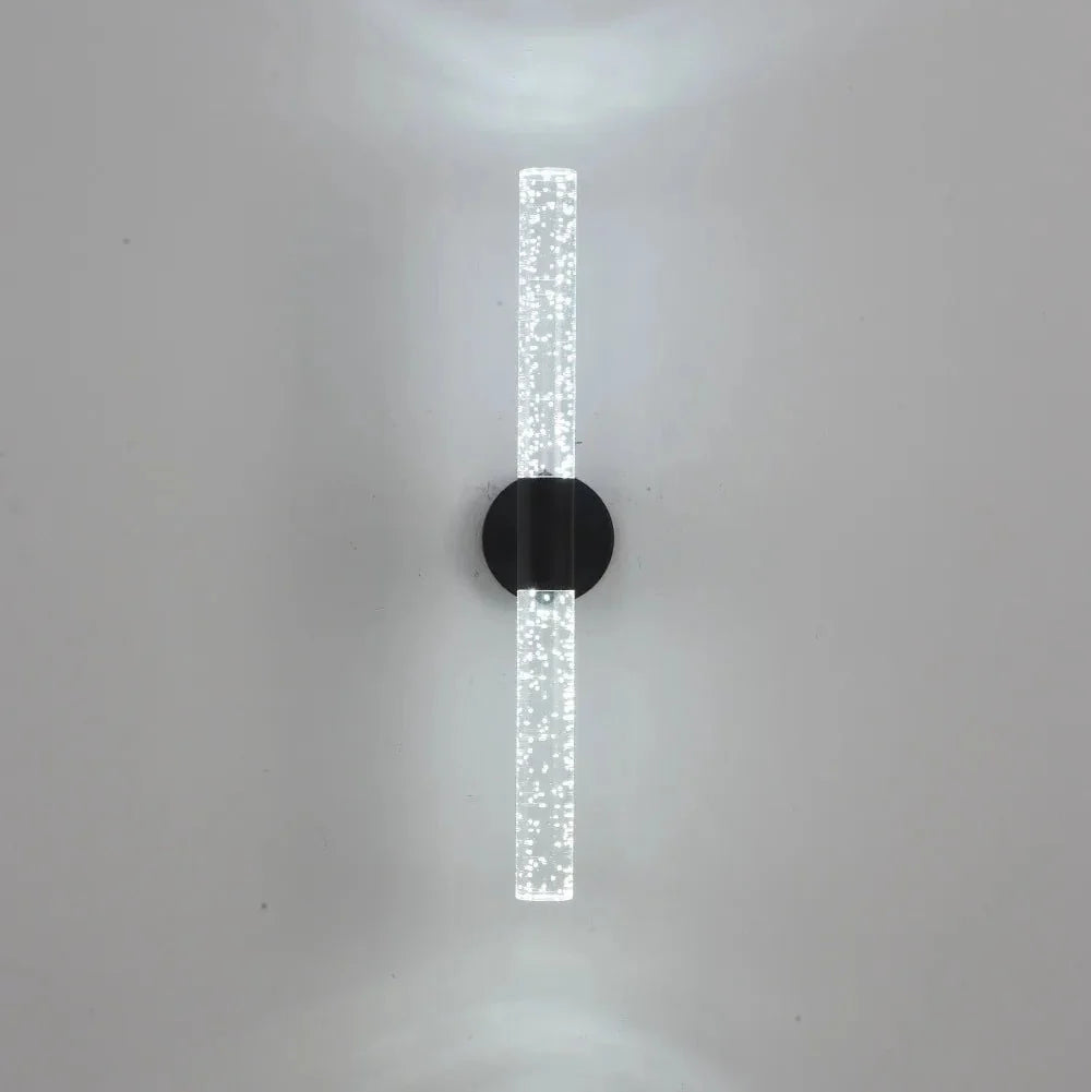 Bubble crystal rod wall sconce in black with a cool white 6000K glow