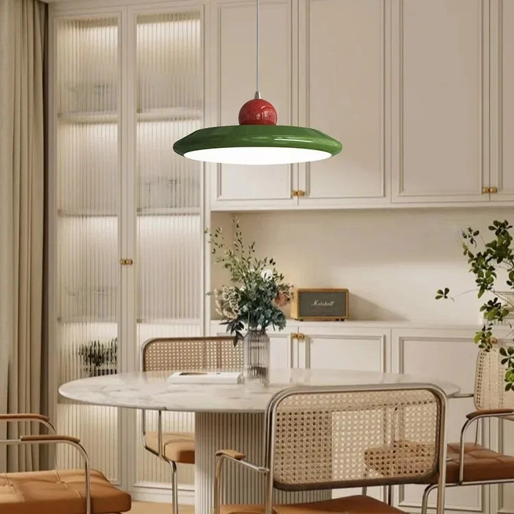 Ellis Bauhaus pendant with green shade over a marble dining table