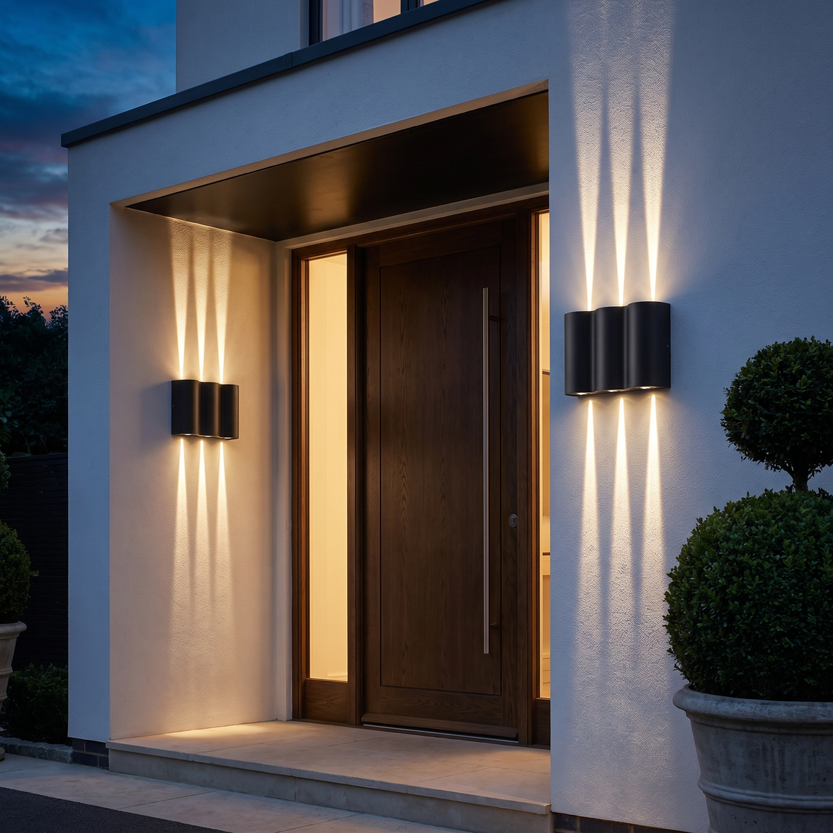 Wavemere 6 Light warm white, pair flanking a sheltered front entrance at dusk